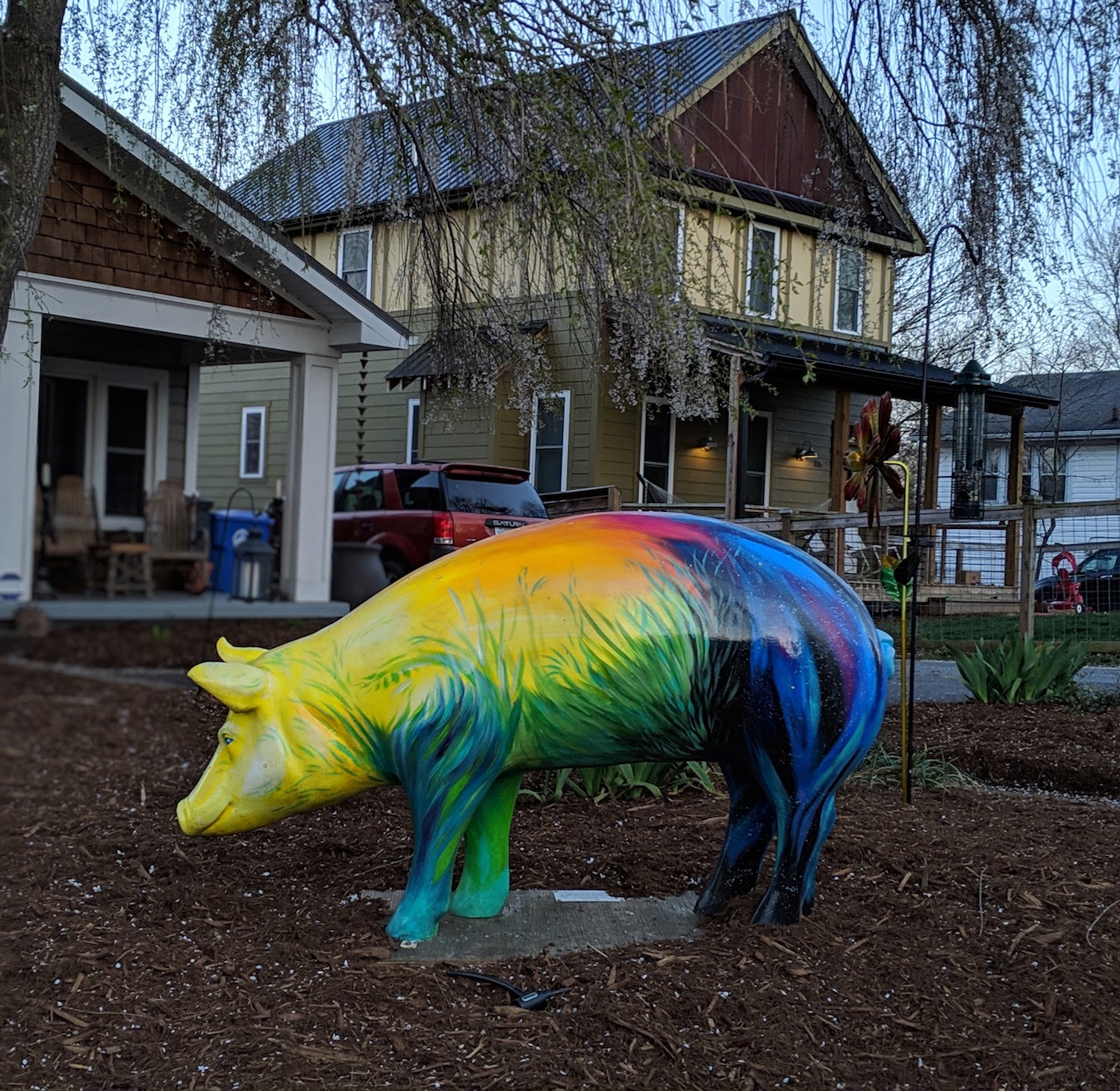 Top tips for moving to Asheville. This photo is of a rainbow pig scultpture taken in the west asheville neighborhood.