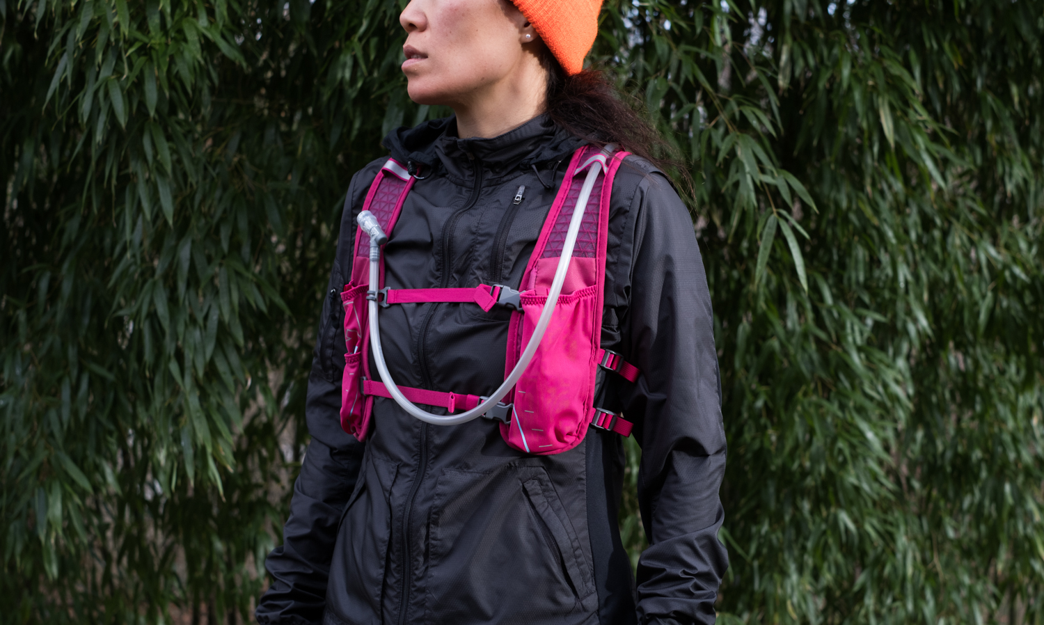 Front view of the Nathan TrailMix 7Liter Women's Multi-Adventure Vest in Sangria/Magenta Purple/Sky Blue