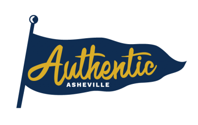 A logo with a dark blue flag representing the Blue Ridge mountains, with the words Authentic Asheville in gold and white.